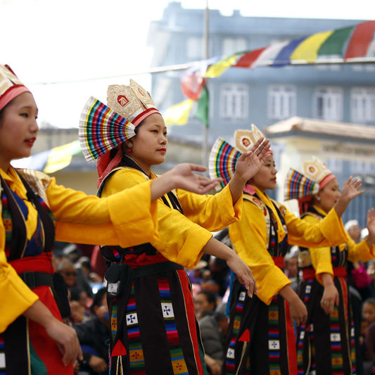 Tibetan women perform a traditional dance during a function to mark Lhosar or Tibetan New Year, at Bhirkuti School in Bouddha, Kathmandu on Thursday, February 11, 2016. Photo: Skanda Gautam